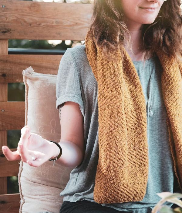 Woman with a calm expression, suggesting a state of relaxation and well-being.